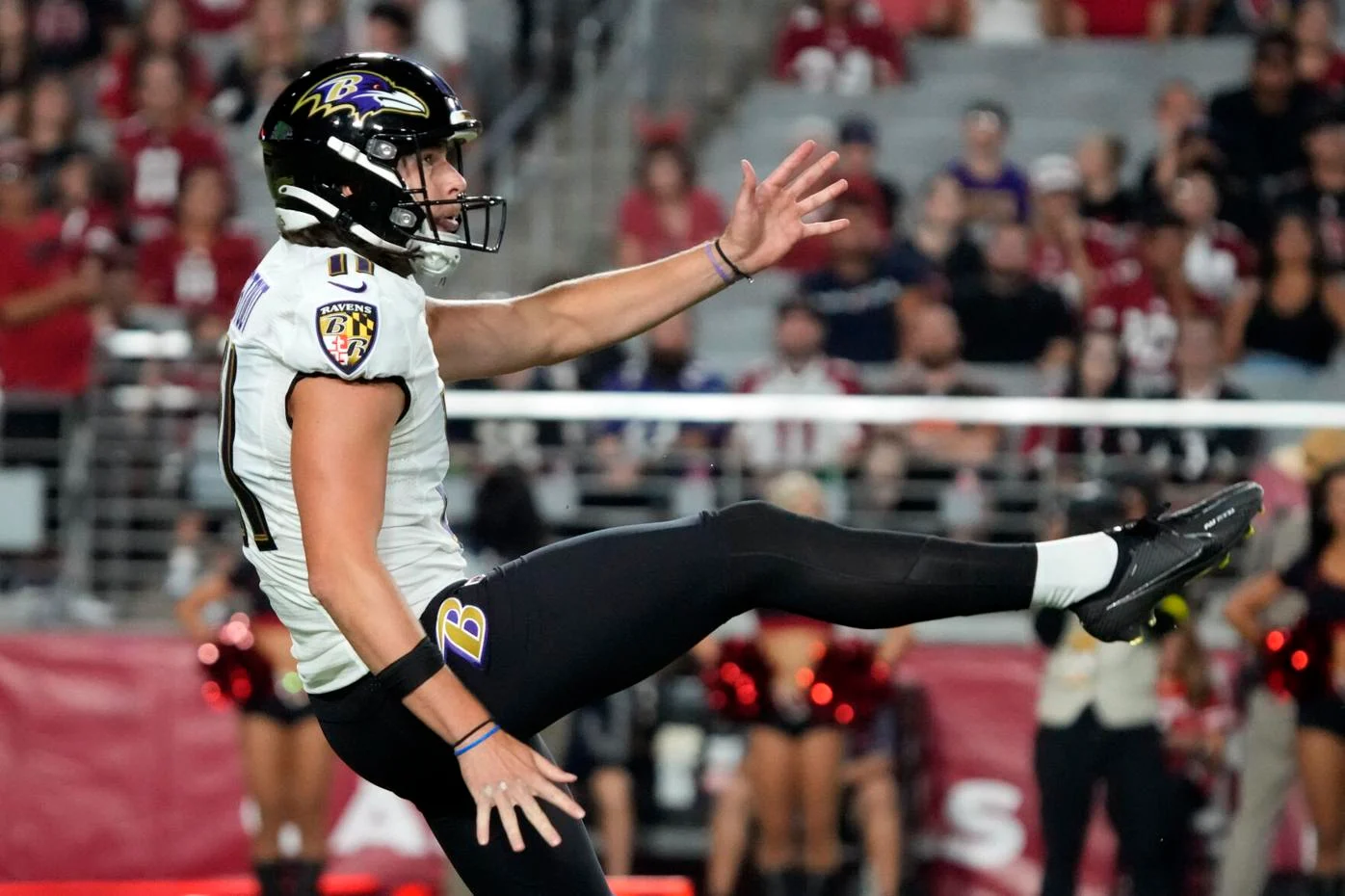 Baltimore Ravens punter Jordan Stout (11) runs off the field at