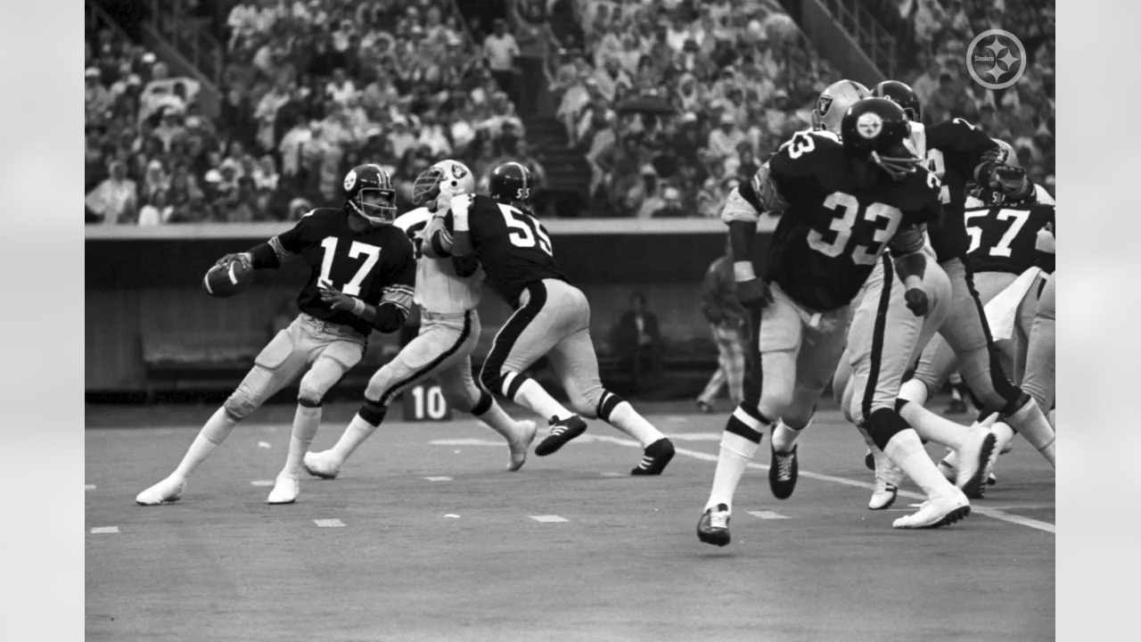 Steelers reserve quarterback Terry Bradshaw, sporting an early beard, warms  up his throwing arm on the sideline prior to entering 17-0 loss to the  Oakland Raiders in Pittsburgh, Sept. 29, 1974. Bradshaw