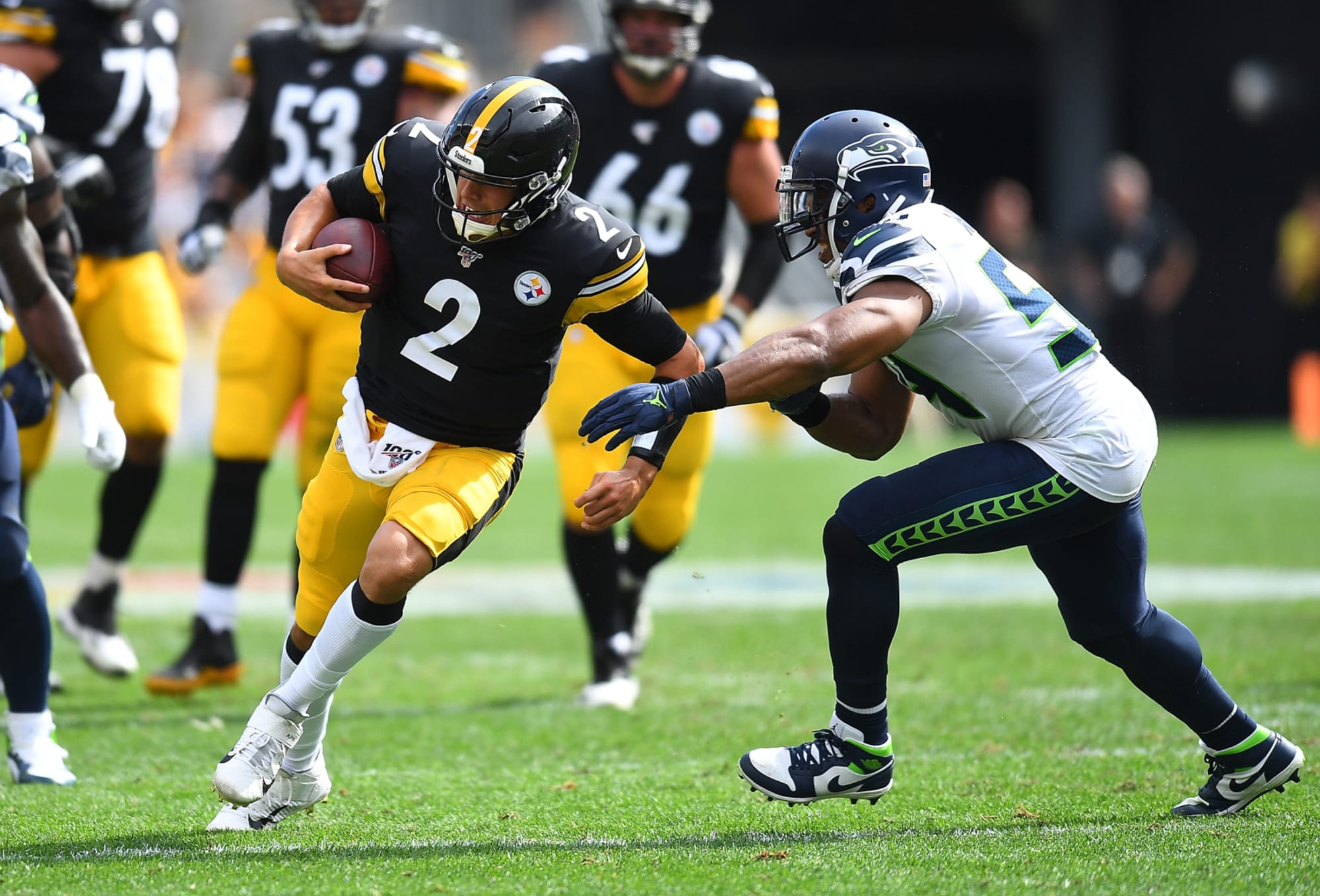 Tanner Morgan of the Pittsburgh Steelers hands off during a