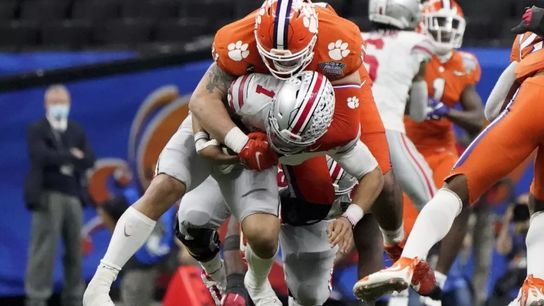 Clemson DT Bryan Bresee sacks Ohio State QB Justin Fields in the College Football Playoff Semifinals | Gerald Herbert - AP