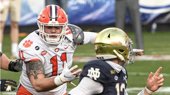 Clemson DT Bryan Bresee pressures Notre Dame QB Ian Book in the 2020 ACC Championship Game at Bank of America Stadium | Ken Ruinard - USA Today Sports