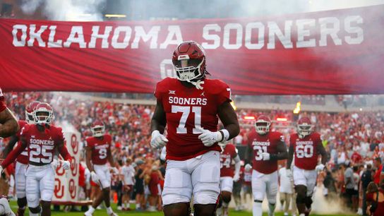 Oklahoma tackle, Anton Harrison takes the field with his teammates during the 2022 college football regular season. | Photo by Brian Bahr / Getty Images