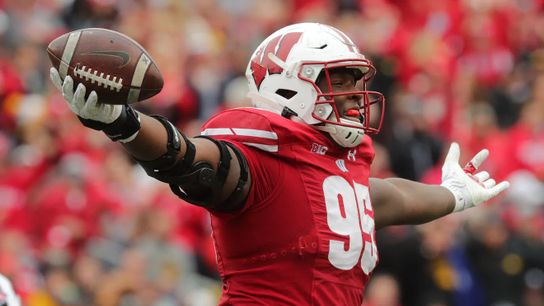 Wisconsin nose tackle, Keeanu Benton celebrates a fumble recovery against Iowa on Sept. 30. | Credit: Mark Hoffman / Milwaukee Journal Sentinal