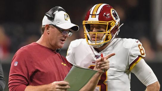 Jay Gruden coaches quarterback Dwayne Haskins during his time in Washington as head coach