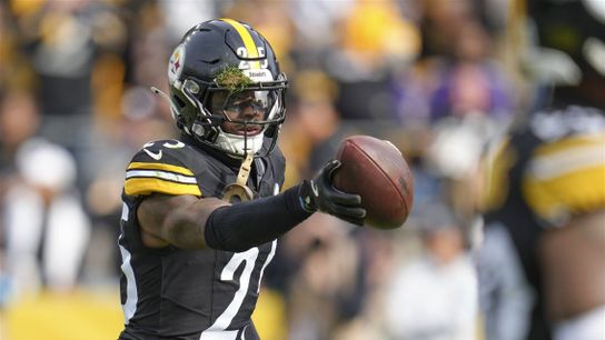 Steelers safety DeShon Elliott holds the ball up after a play against his former team the Baltimore Ravens at home in Acrisure Stadium during the 2024 season