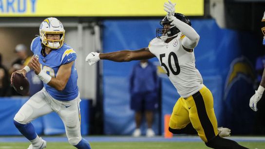 Steelers linebacker, Delontae Scott, chases down Los Angeles Chargers quarterback Justin Herbert