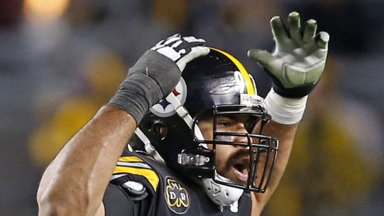 Steelers defensive lineman Cam Heyward hypes up the home crowd at Acrisure Stadium during a game