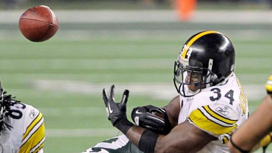 Green Bay Packers Clay Matthews tackles Rashard Mendenhall and causes him to lose the ball during Super Bowl XLV, February 6, 2011.