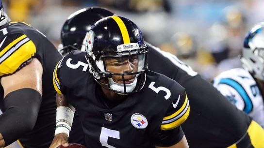 Josh Dobbs hands off against the Panthers – Photo Credit: USA Today
