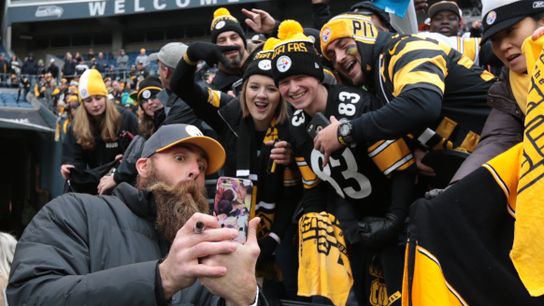 Brett Keisel, a former defensive end for the NFL's Pittsburgh Steelers, takes a selfie with Steelers fans before a game in Seattle on Sunday, November 29.