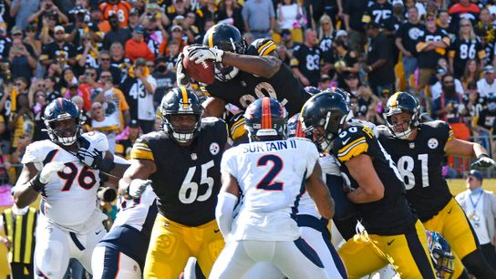 Pittsburgh Steelers running back Najee Harris jumps over the goal line during an NFL game against the Denver Broncos on Oct. 10, 2021, at Heinz Field in Pittsburgh.