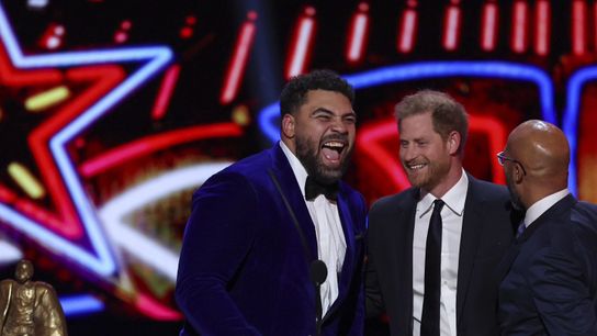 Steelers Cam Heyward laughing with Prince Harry after winning the 2023 Walter Payton Man of the Year Award during the NFL Honors Ceremony