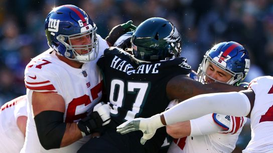 Eagles defensive tackle Javon Hargrave hits Giants quarterback Jake Fromm during an NFL game in Philadelphia.