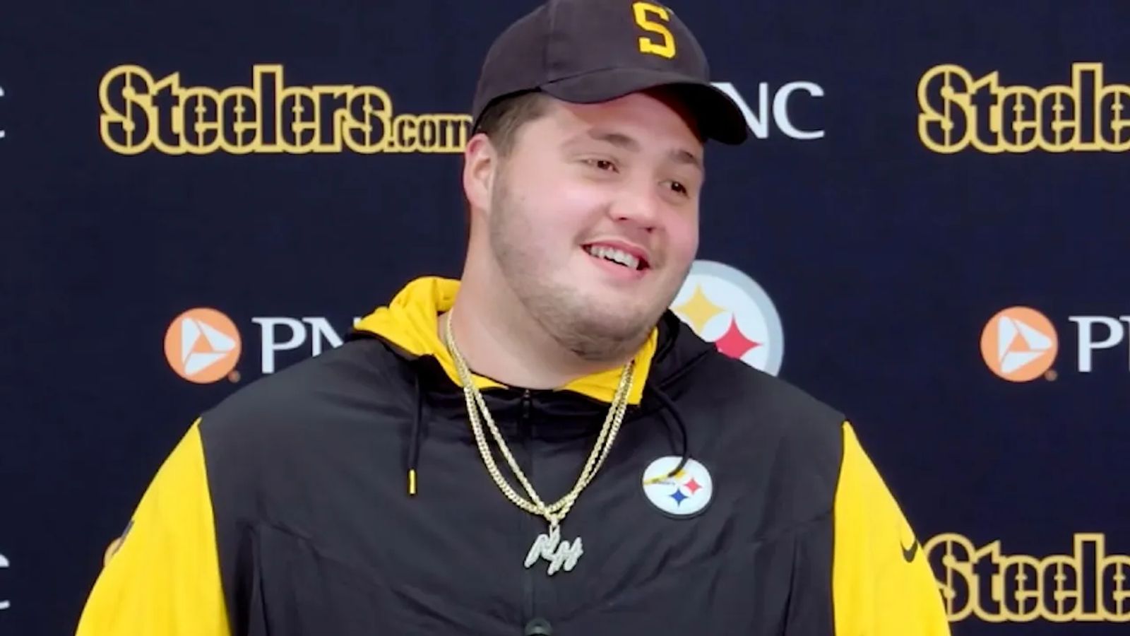 Steelers players wearing caps at training camp