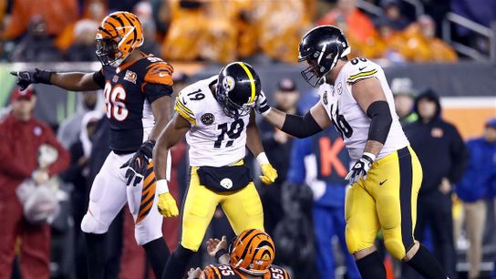 Steelers former WR Juju Smith-Schuster stands over Bengals LB Vontaze Burfict after hitting him