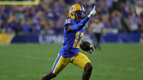 M.J. Devonshire runs with a football during a game M.J. Devonshire runs with a football during a game
