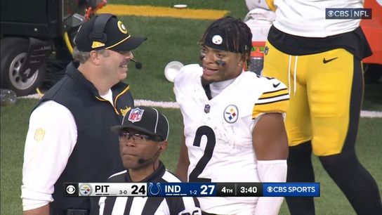 Steelers' Arthur Smith talks with Justin Fields during a game.