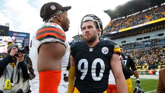 Steelers' TJ Watt meets with Browns' Myles Garrett after a game.