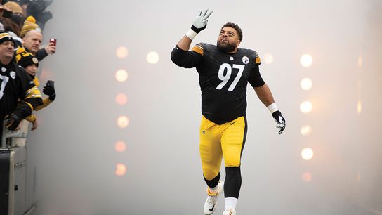 Steelers veteran Cam Heyward runs out of the tunnel and heads to the field during player introductions