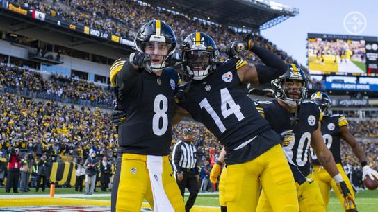 Pittsburgh Steelers Kenny Pickett and George Pickens celebrating after a touchdown in a game at Acrisure Stadium in 2022