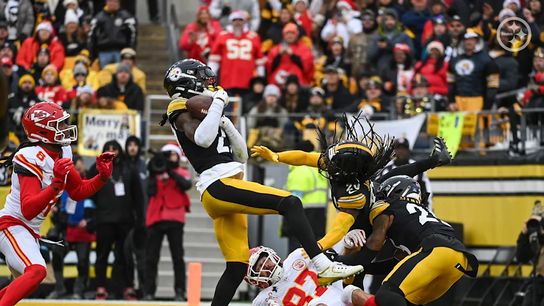 Pittsburgh Steelers' DB Cory Trice Jr. and others during a play against the Kansas City Chiefs on Christmas Day in 2024.