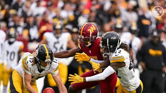 Pittsburgh Steelers' James Pierre and Ben Skowronek recovering a dropped punt against the Commanders in 2024.