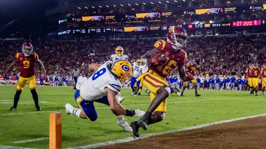 USC wide receiver Tahj Washington scampers into the end zone after an eight-yard catch against California linebacker Jackson Sirmon in the second half at the Coliseum in 2022. USC wide receiver Tahj Washington scampers into the end zone after an eight-yard catch against California linebacker Jackson Sirmon in the second half at the Coliseum in 2022.