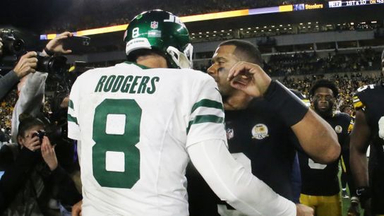 Former Jets QB Aaron Rodgers meets with former Steelers QB Russell Wilson after a regular season game at Acrisure Stadium in Pittsburgh, PA during the 2024 season.