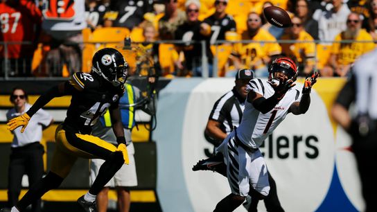 Cincinnati Bengals WR Ja'Marr Chase attempting to make a catch against the Steelers defense.