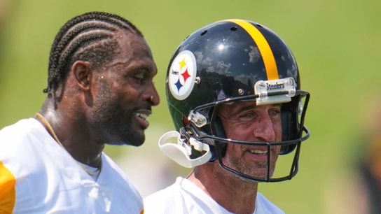 Steelers quarterback Aaron Rodgers and wide receiver DK Metcalf smile as they talk during training camp in Latrobe, PA. Steelers quarterback Aaron Rodgers and wide receiver DK Metcalf smile as they talk during training camp in Latrobe, PA.
