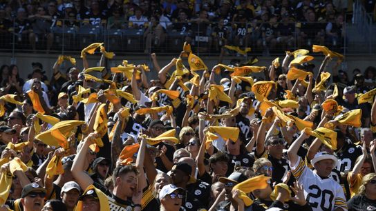 Steelers' fans waving their Terrible Towels while celebrating during a home game at Acrisure Stadium